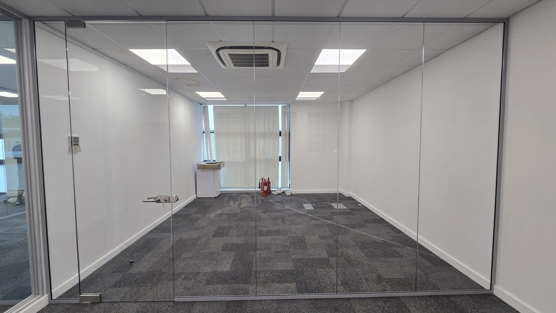 Framed glass partition