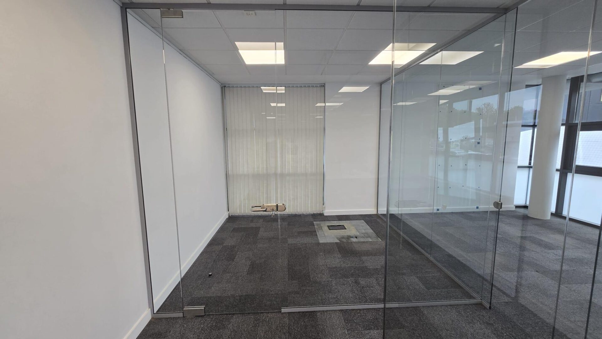 Framed glass partition