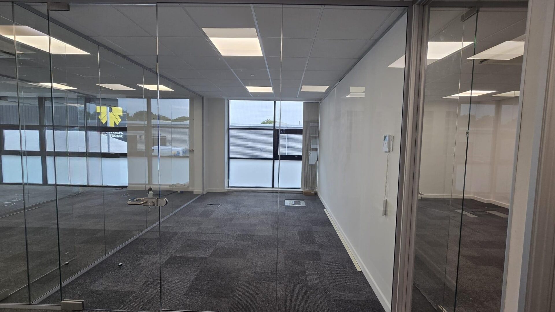 Framed glass partition